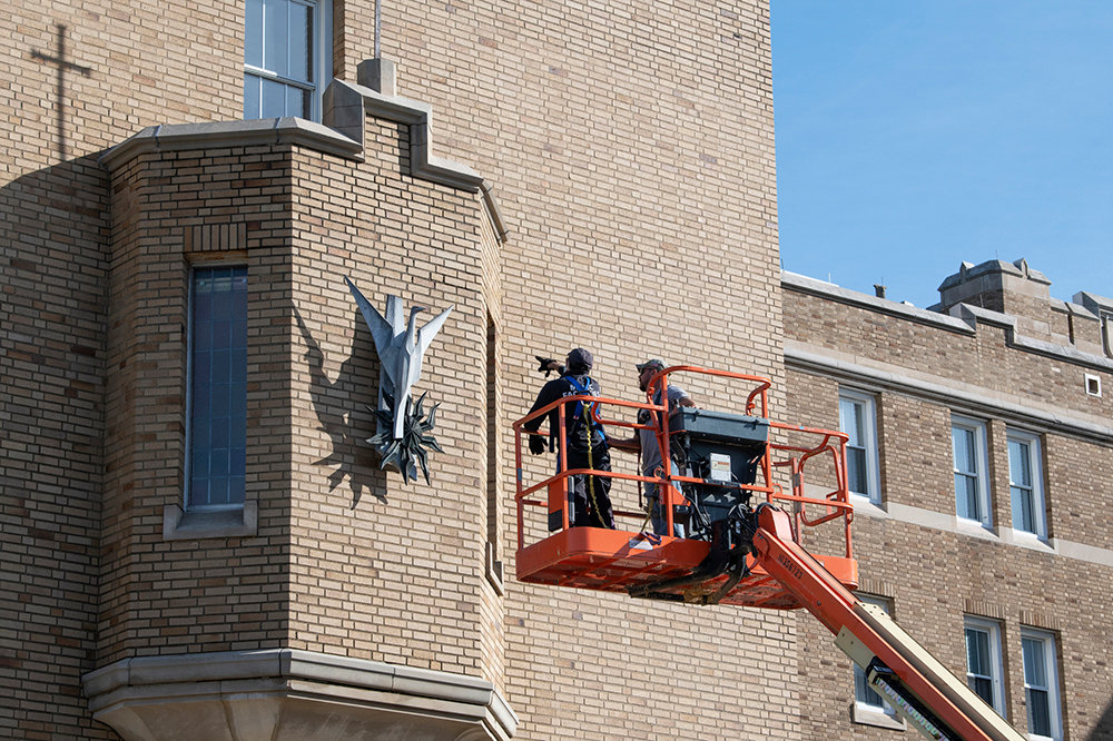 Mount Saint Mary College’s installs  the phoenix sculpture that previously hung outside of Curtin Library on the side of the Dominican Center on Thursday, November 5, 2020.